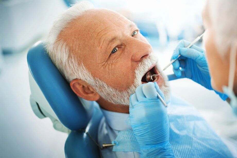 mature man in dental chair